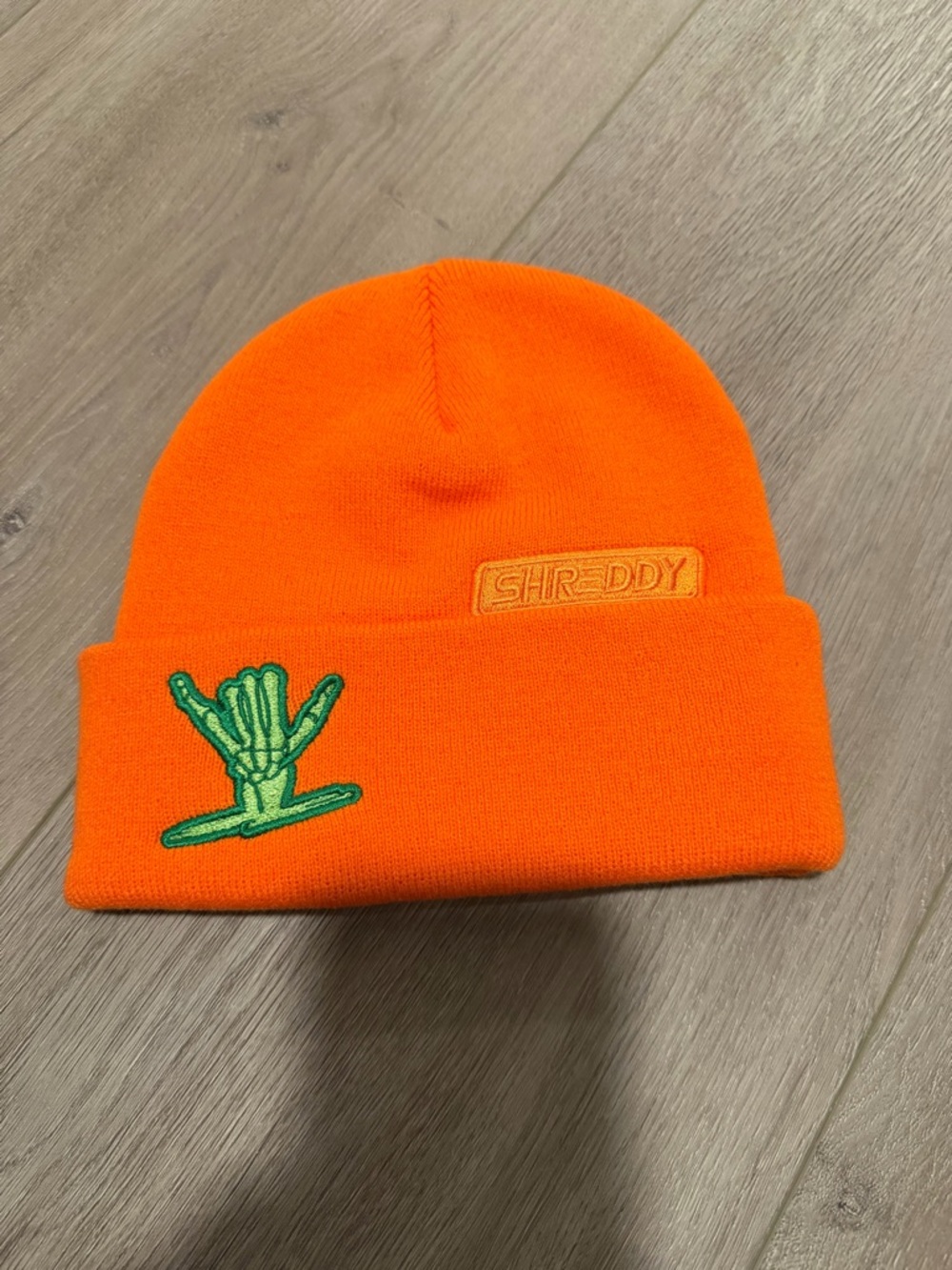 Orange Beanie with Green Skeleton Hand Patch
